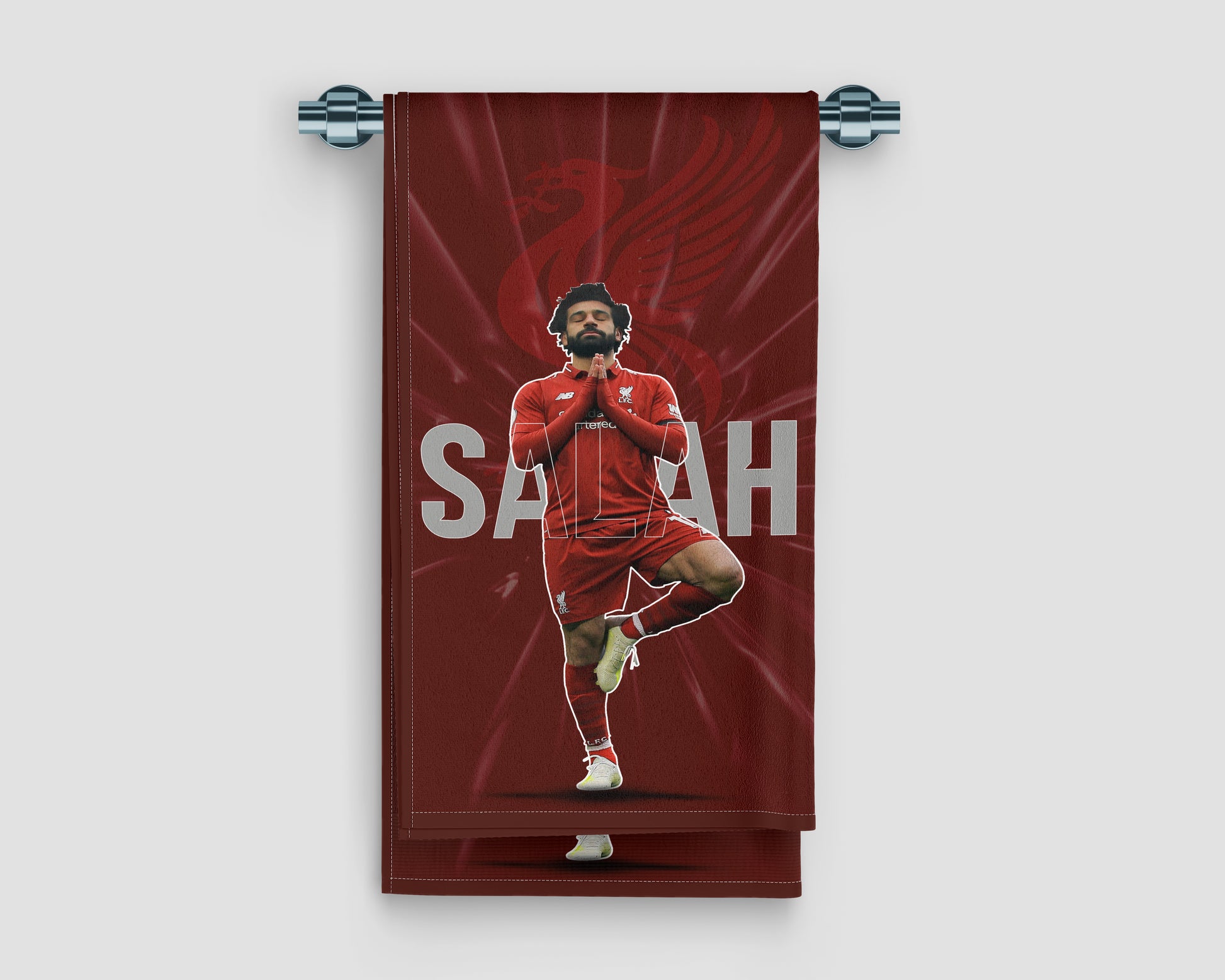 Towel with a soccer player in red uniform on a red background, featuring the name 'Saray'.