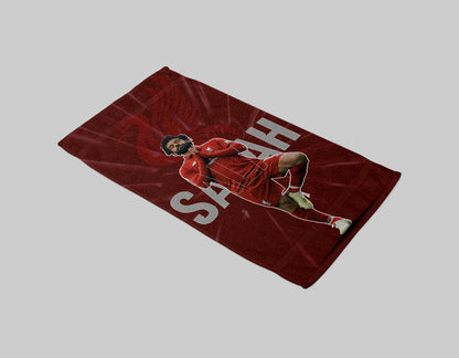 Towel with a soccer player design and 'Sarab' branding on a gray background